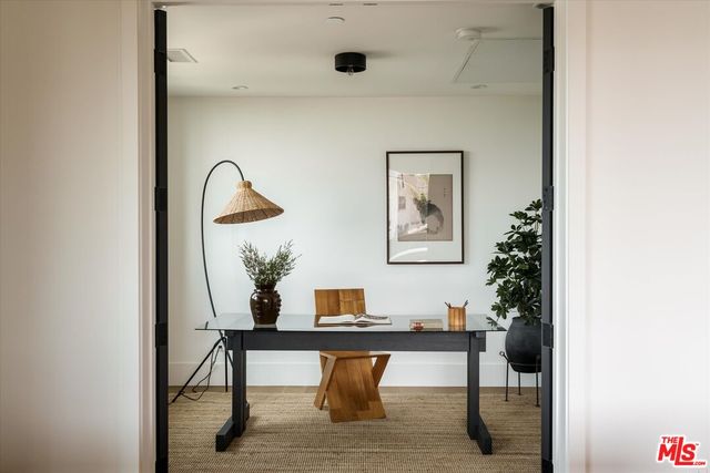 a view of a workspace with furniture