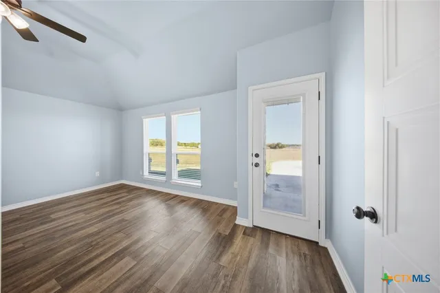 a view of a bathroom with a tub a sink and a shower