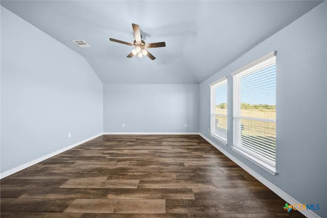 a bathroom with a shower and a mirror