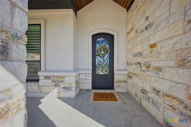 a large kitchen with stainless steel appliances granite countertop a lot of counter space and wooden floor