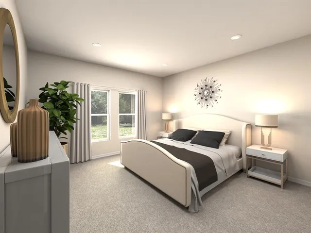 a spacious bedroom with a bed and a window