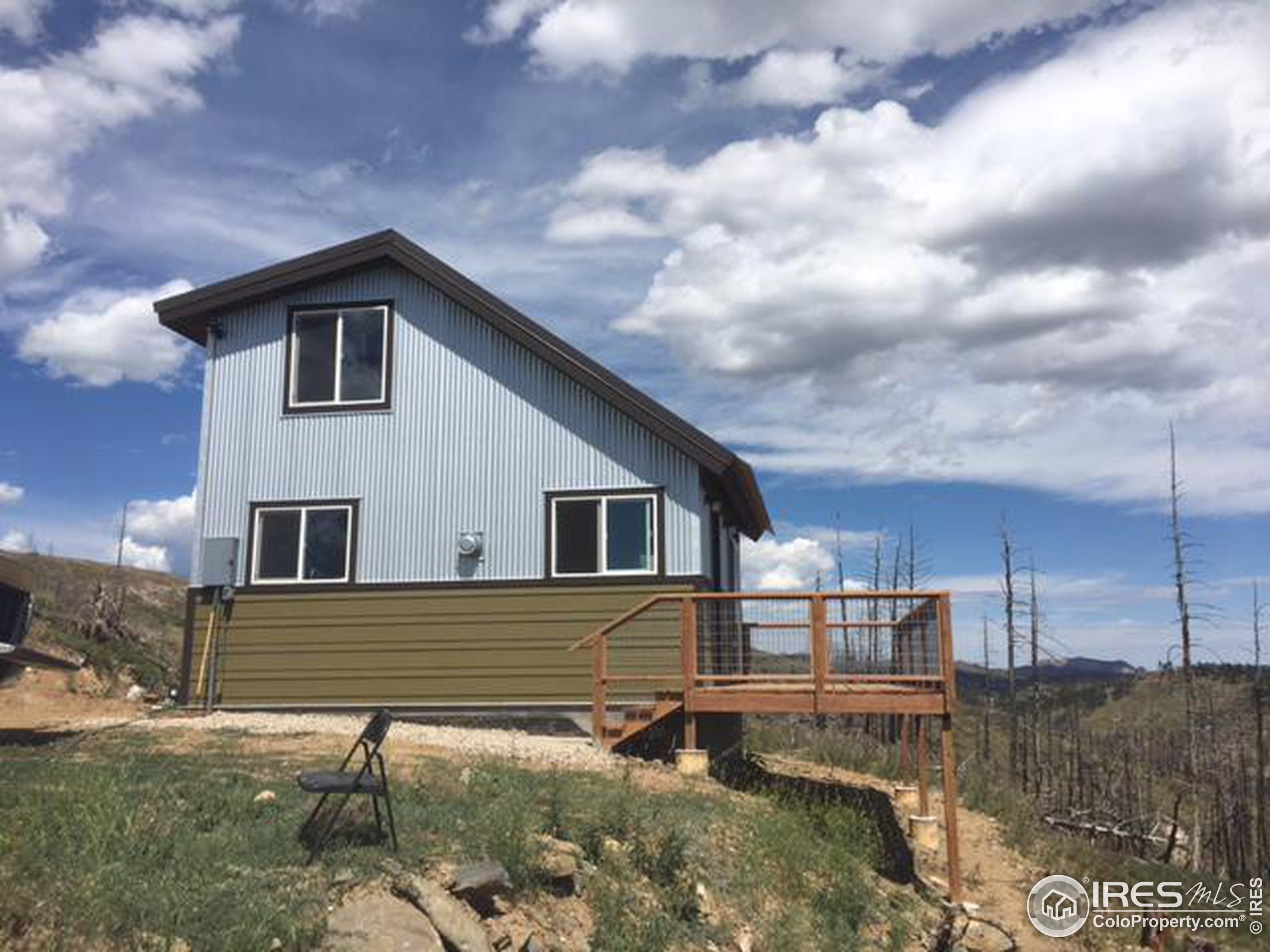 2518 Whale Rock Road Bellvue, CO 80512 - Photo 1 of 19 a view of a house with a yard