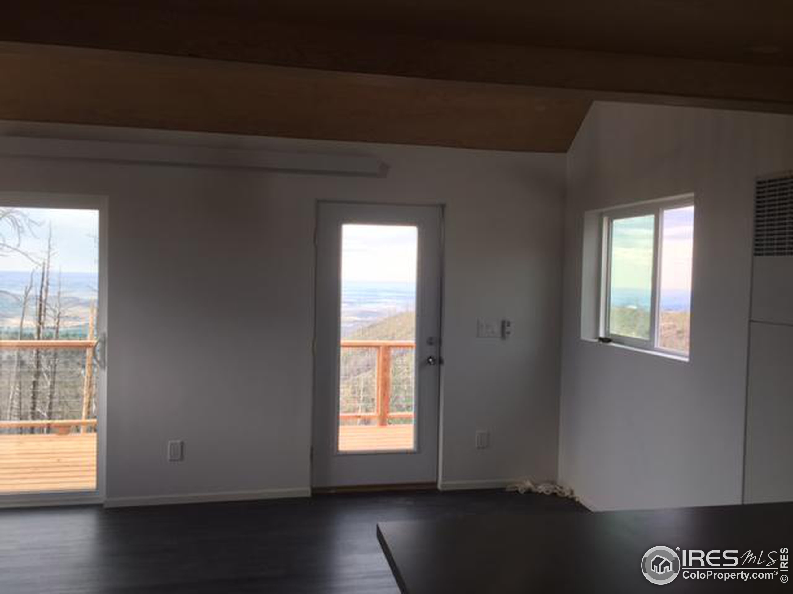 2518 Whale Rock Road Bellvue, CO 80512 - Photo 5 of 19 a view of an empty room and window