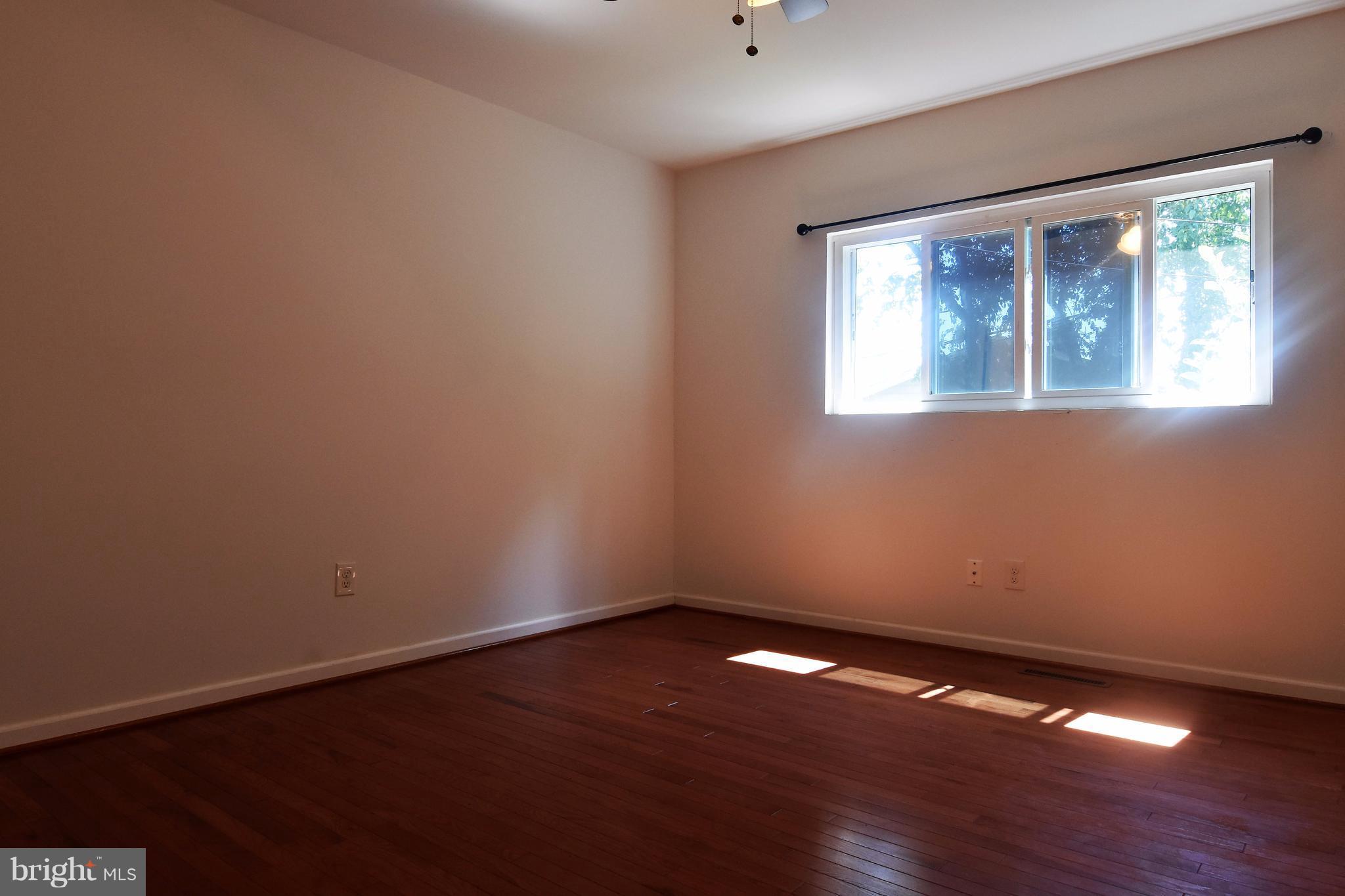 221 Dunlap Road Pasadena, MD 21122 - Photo 12 of 30 12x13 master bedroom w/ hardwood floors