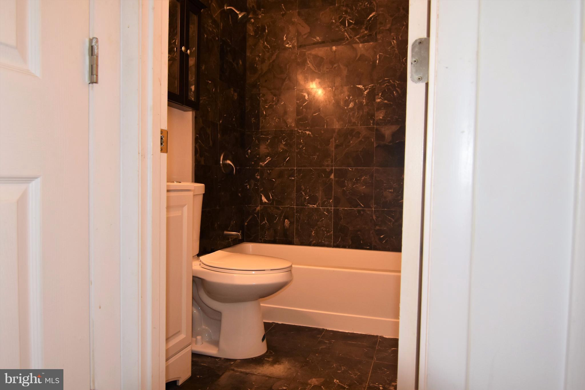 221 Dunlap Road Pasadena, MD 21122 - Photo 19 of 30 ceramic tile full bath main level