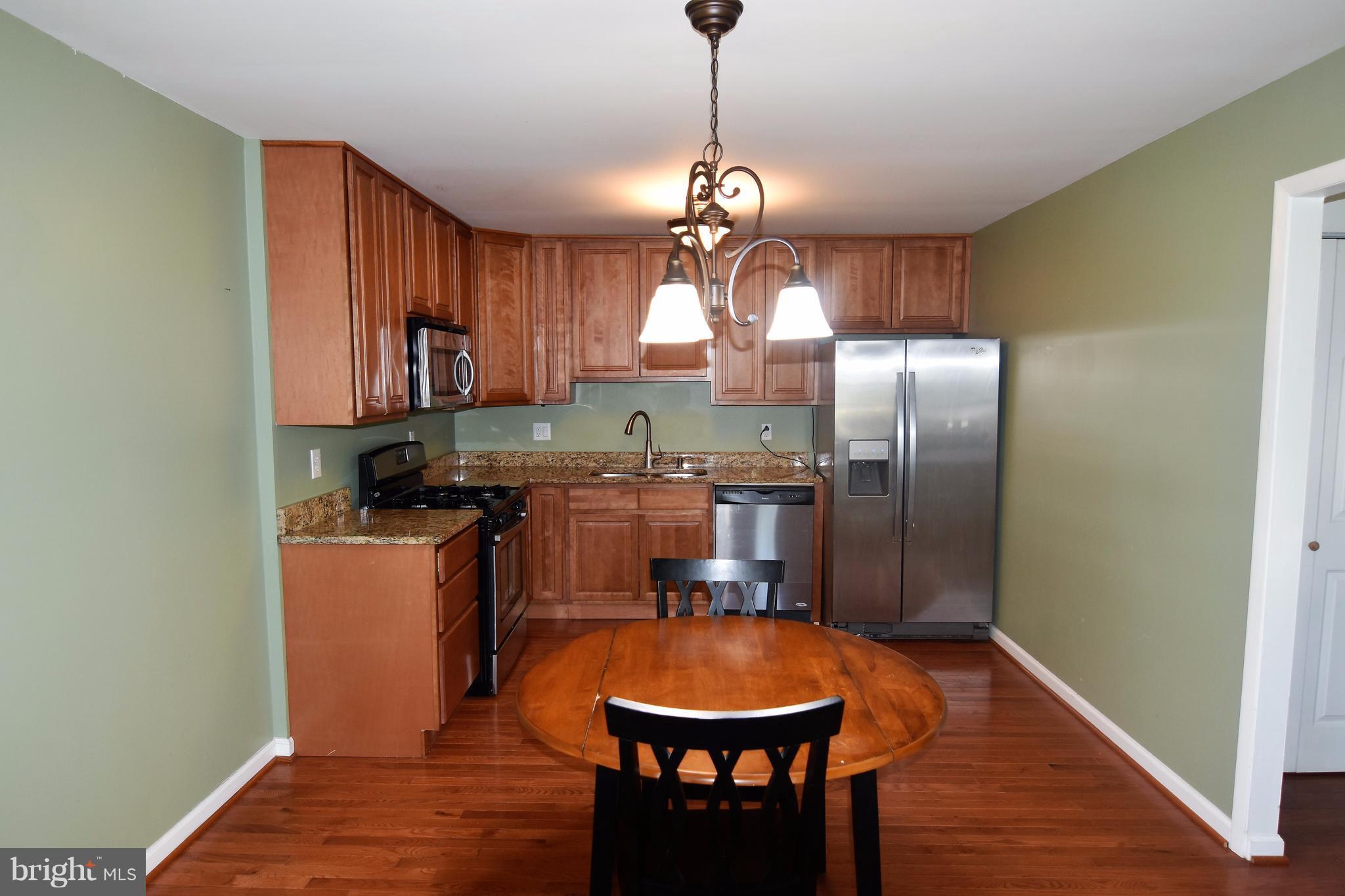 221 Dunlap Road Pasadena, MD 21122 - Photo 4 of 30 11x19 Kitchen w/ hardwood floors