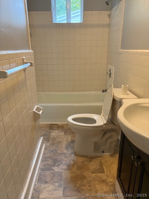 208 Fairview Avenue, Unit 2 Bridgeport, CT 06606 - Photo 11 of 11 a bathroom with a toilet and a bathtub