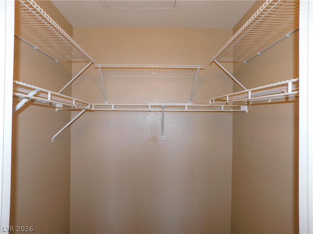 7255 West Sunset Road, Unit 2029 Las Vegas, NV 89113 - Photo 13 of 21 Ample storage solutions await within this well-appointed closet, designed for optimal organization.