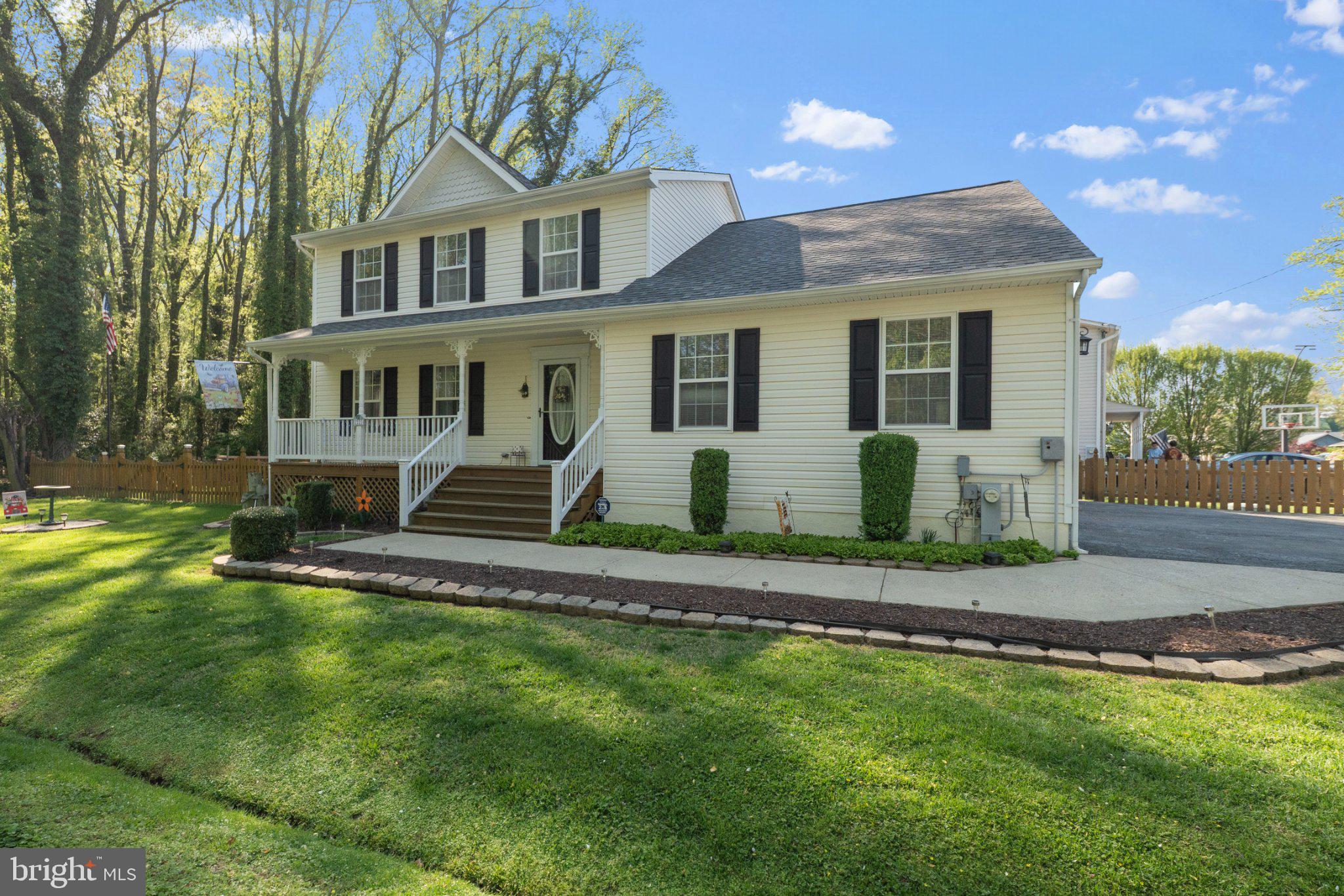 1221 Cedar Lane Edgewater, MD 21037 - Photo 1 of 58 a front view of a house with a yard