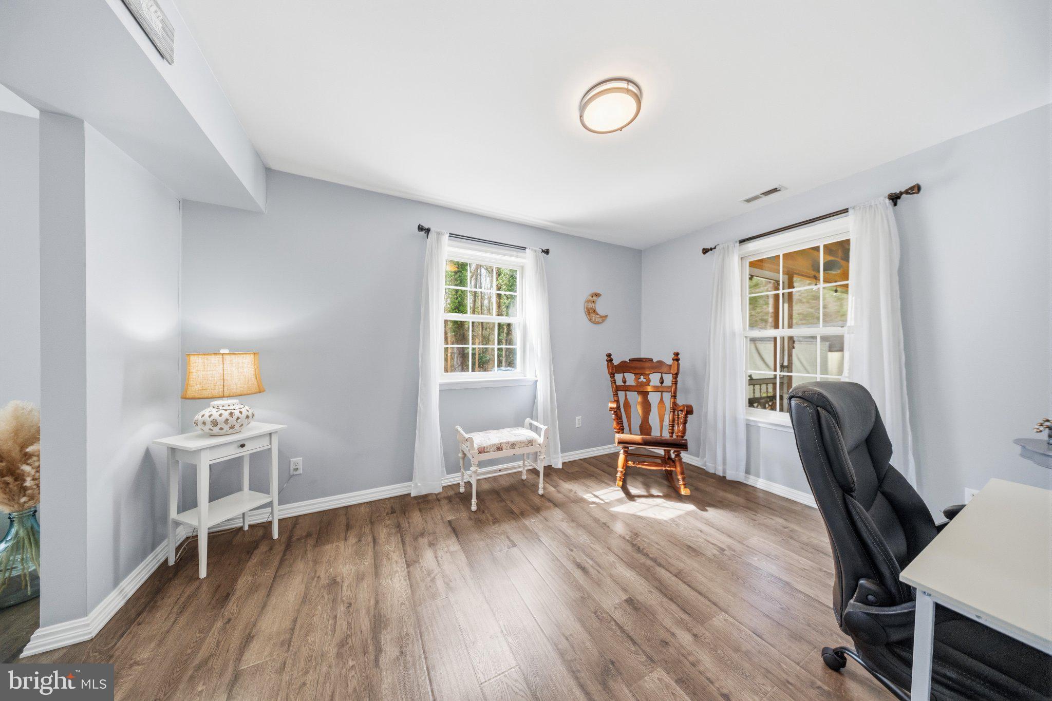 1221 Cedar Lane Edgewater, MD 21037 - Photo 12 of 58 a view of a workspace with furniture and a window