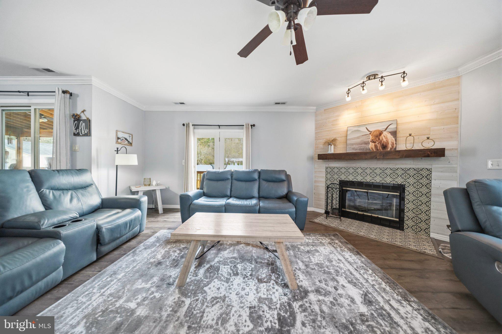 1221 Cedar Lane Edgewater, MD 21037 - Photo 20 of 58 a living room with furniture and a fireplace