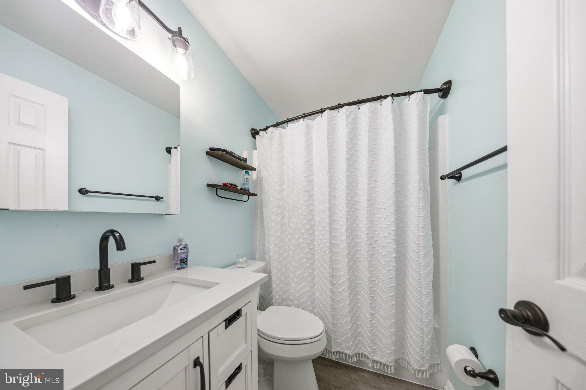1221 Cedar Lane Edgewater, MD 21037 - Photo 24 of 58 a bathroom with a sink toilet and shower
