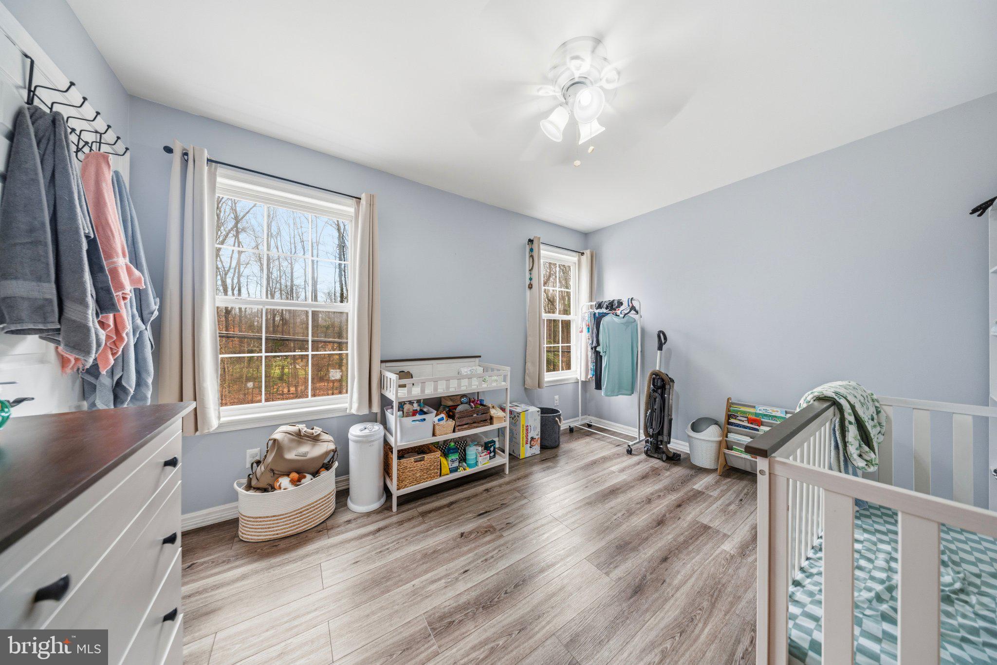 1221 Cedar Lane Edgewater, MD 21037 - Photo 27 of 58 a bedroom with furniture and a window