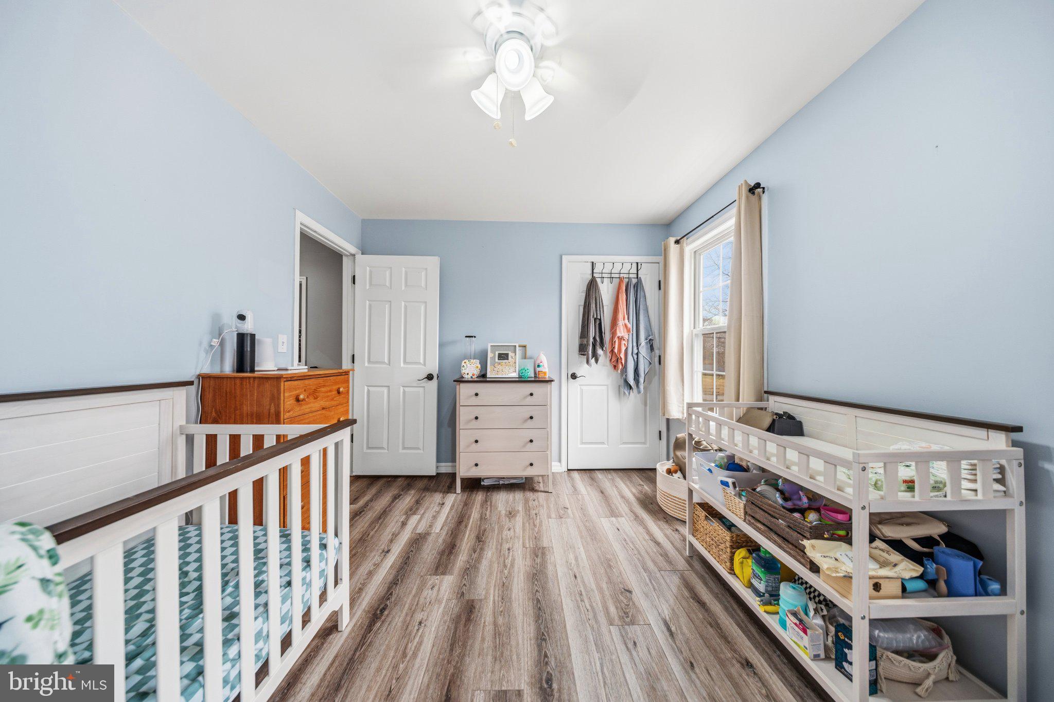 1221 Cedar Lane Edgewater, MD 21037 - Photo 28 of 58 a bedroom with furniture and baby crib
