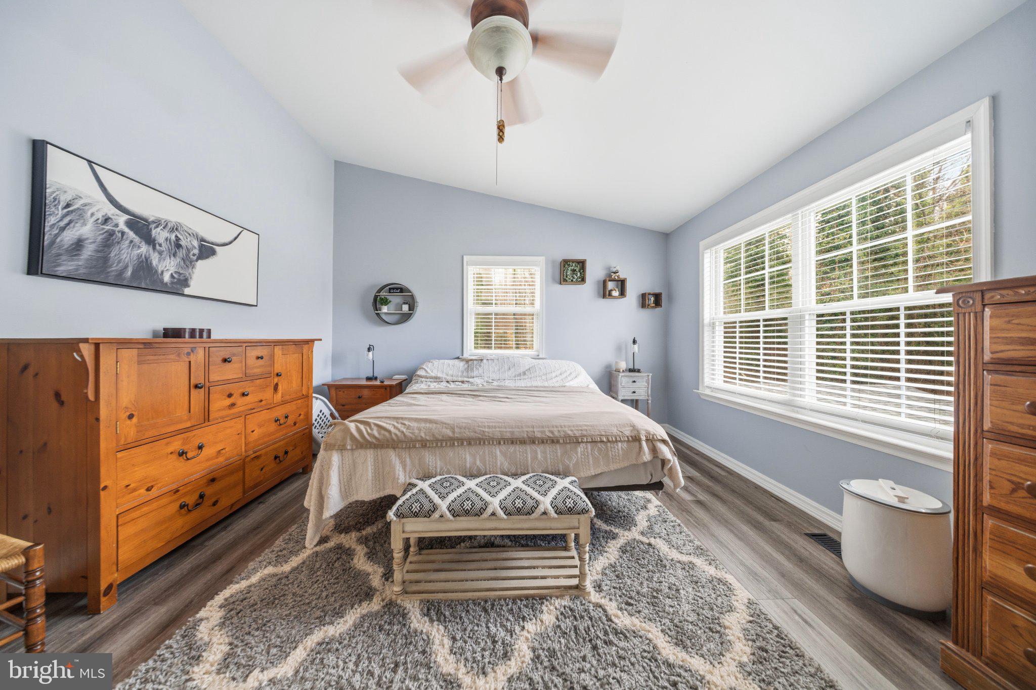 1221 Cedar Lane Edgewater, MD 21037 - Photo 31 of 58 a bedroom with a bed and wooden floor