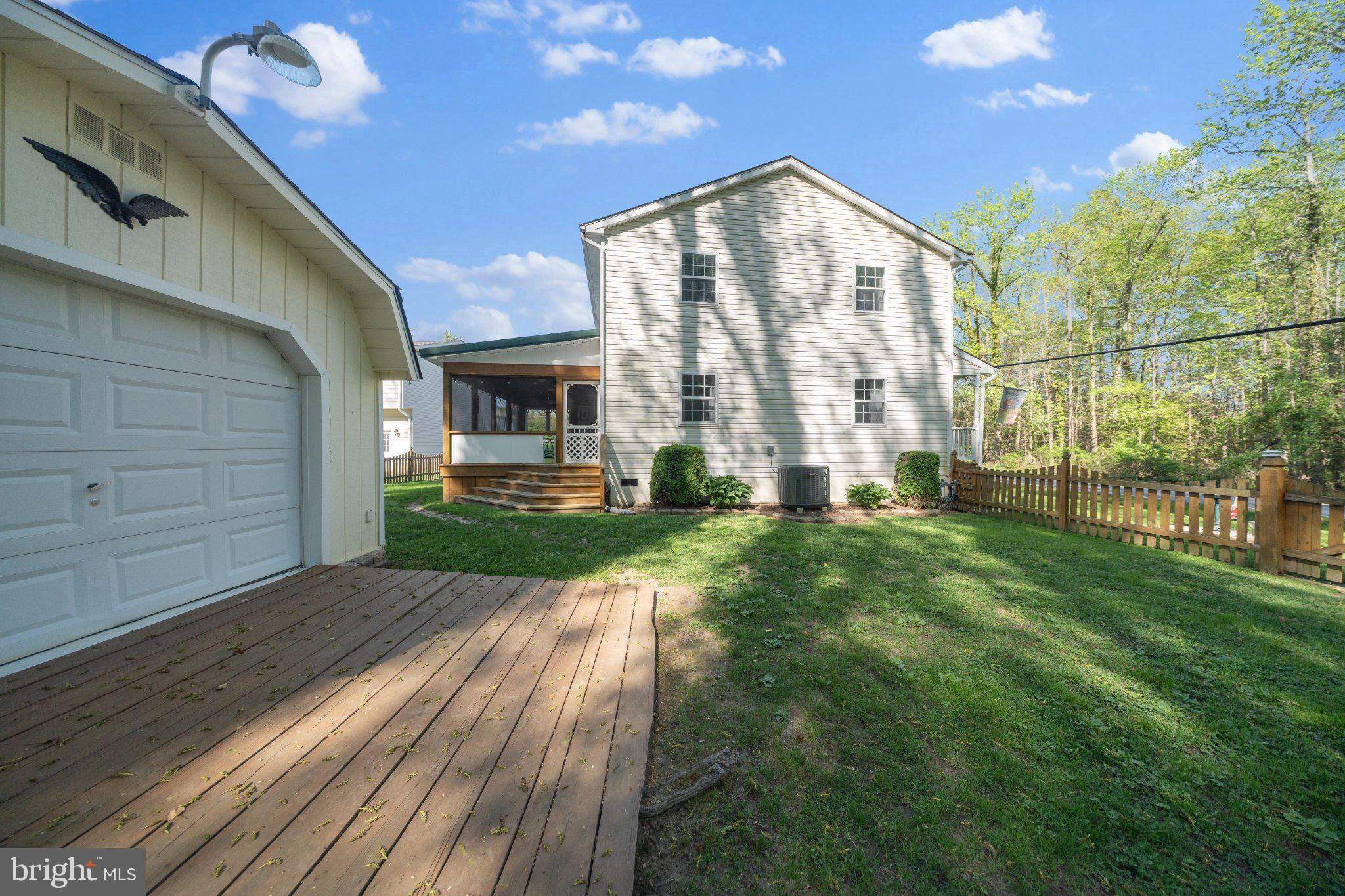 1221 Cedar Lane Edgewater, MD 21037 - Photo 40 of 58 a view of backyard with large trees and plants