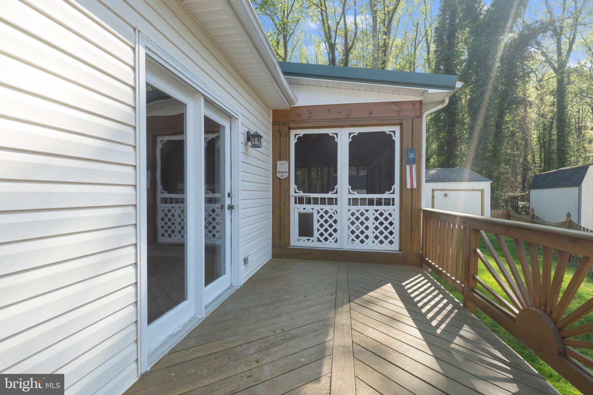 1221 Cedar Lane Edgewater, MD 21037 - Photo 46 of 58 a view of front door deck and pathway