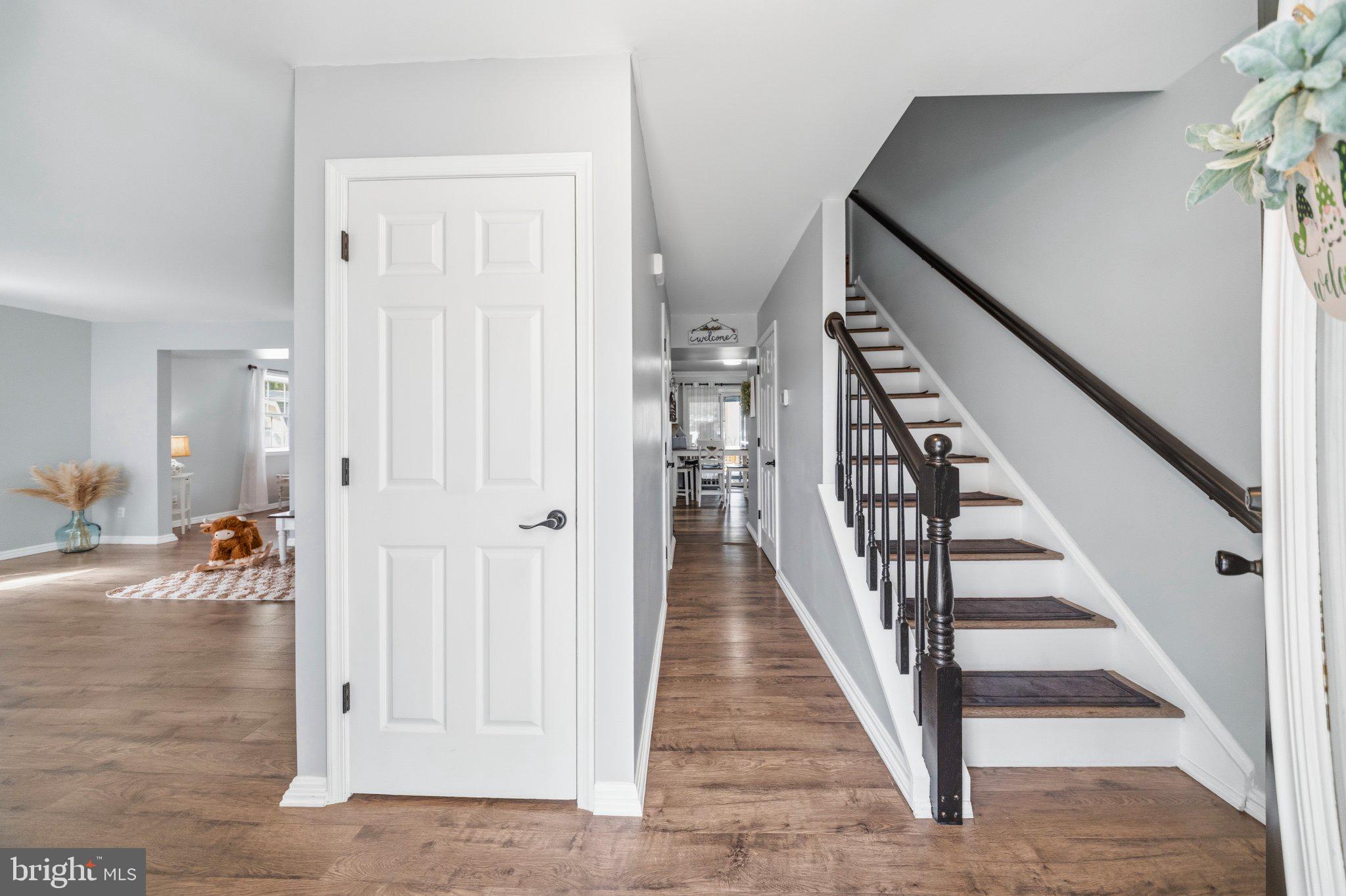 1221 Cedar Lane Edgewater, MD 21037 - Photo 7 of 58 wooden view of a hallway with wooden floor and entryway