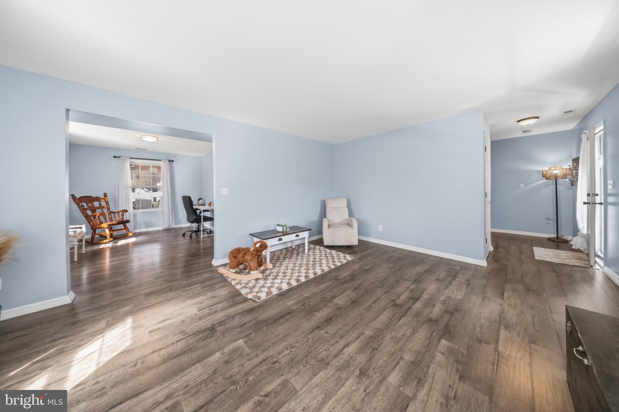 1221 Cedar Lane Edgewater, MD 21037 - Photo 10 of 58 a living room with furniture and a wooden floor