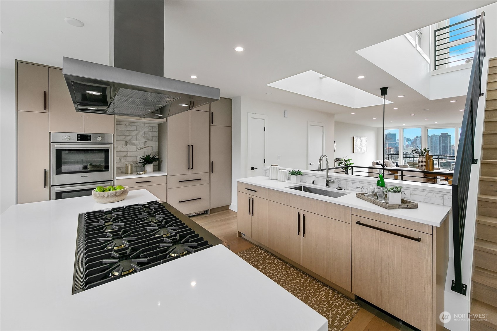 509 Galer Street Seattle, WA 98109 - Photo 20 of 40 a kitchen with stainless steel appliances kitchen island granite countertop a sink and cabinets