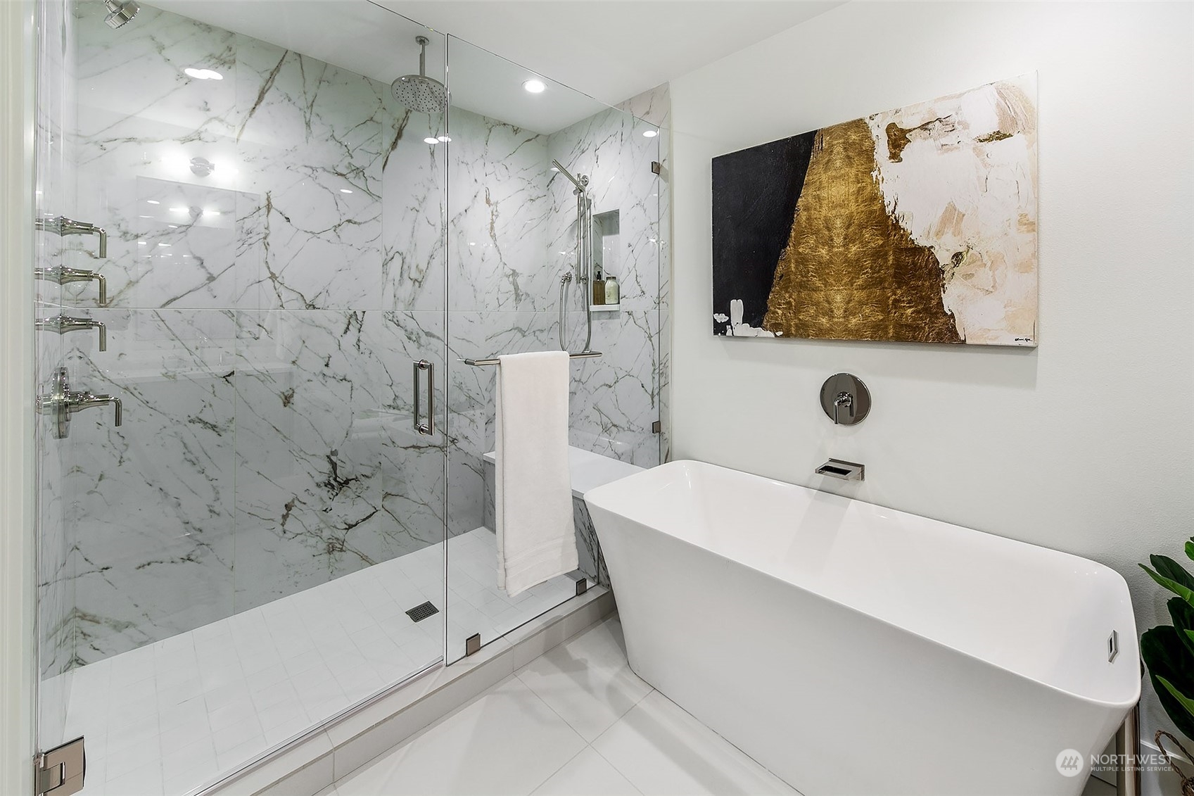 509 Galer Street Seattle, WA 98109 - Photo 26 of 40 a bathroom with a bathtub and shower