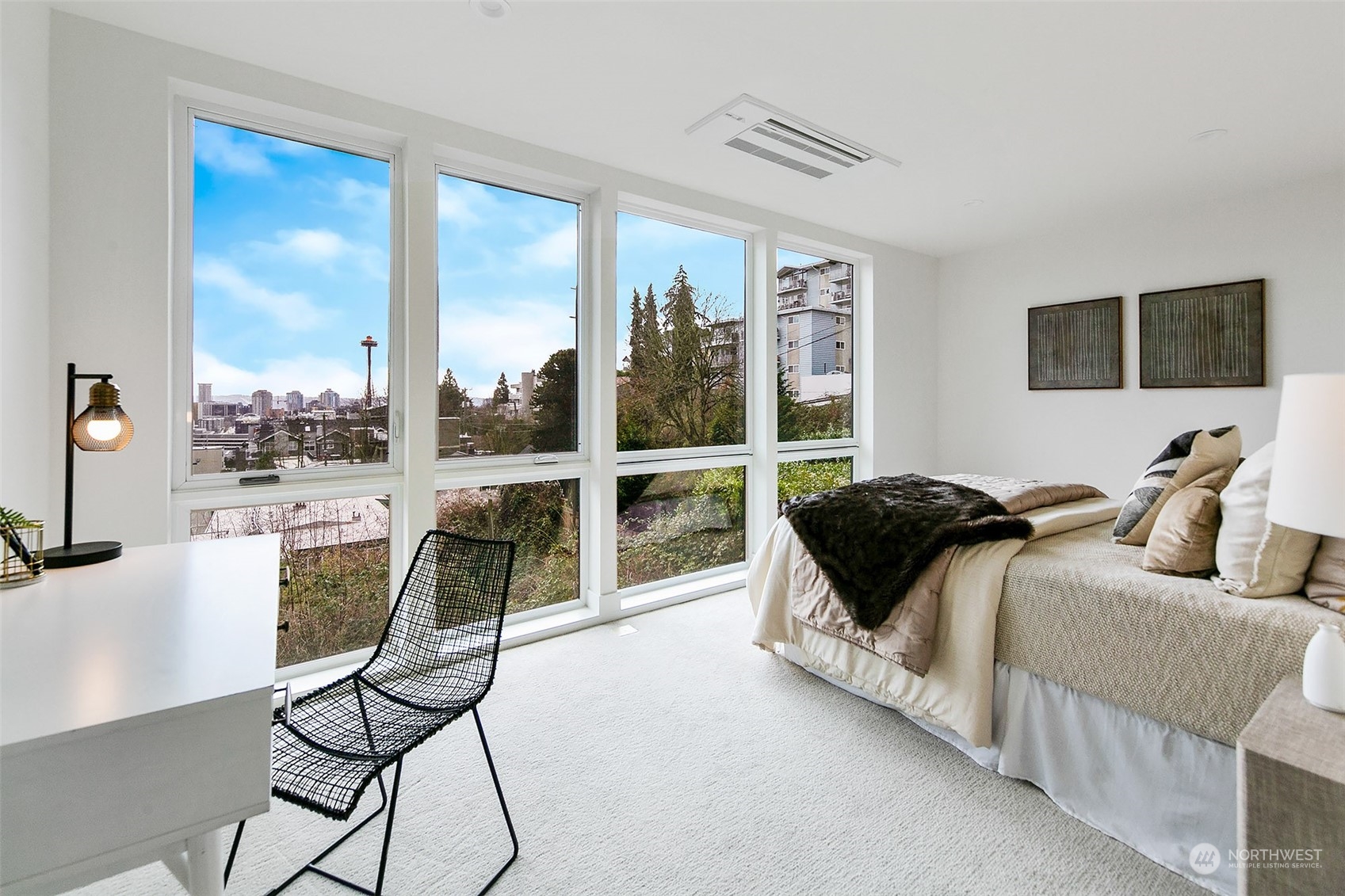 509 Galer Street Seattle, WA 98109 - Photo 30 of 40 a bedroom with a bed and a large window