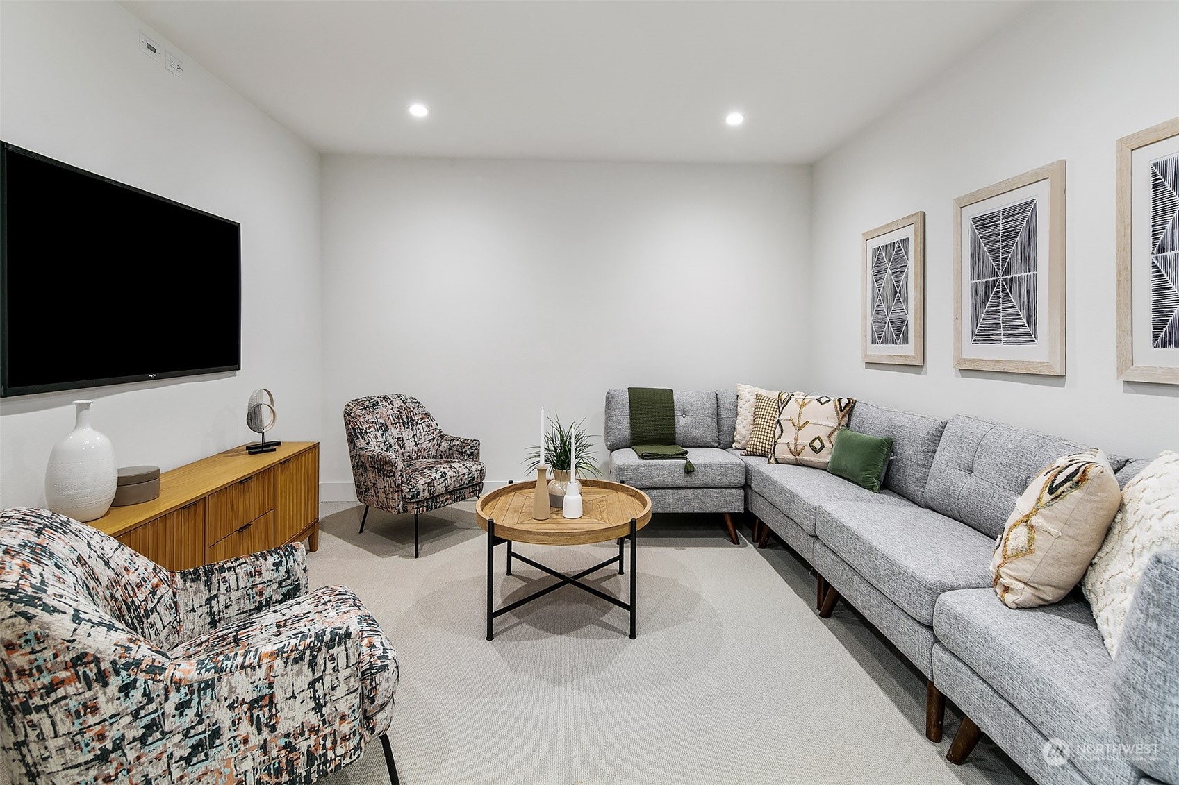 509 Galer Street Seattle, WA 98109 - Photo 33 of 40 a living room with furniture and a flat screen tv