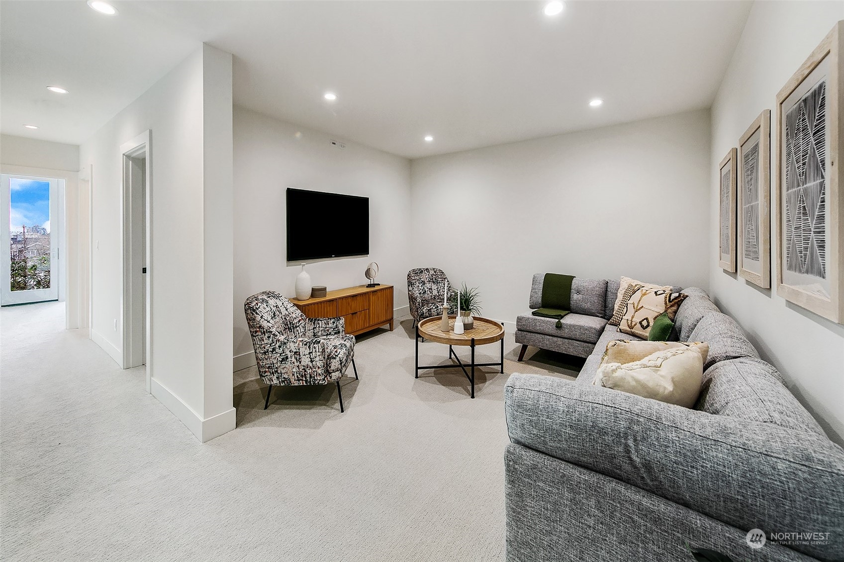 509 Galer Street Seattle, WA 98109 - Photo 34 of 40 a living room with furniture and a flat screen tv