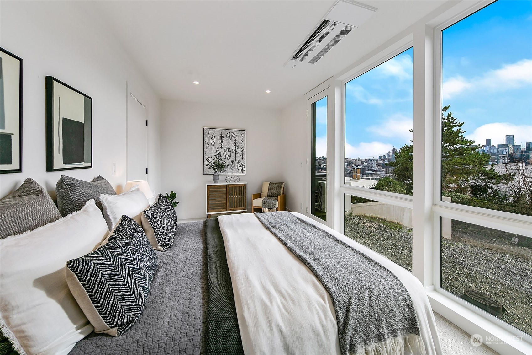509 Galer Street Seattle, WA 98109 - Photo 36 of 40 a bedroom with a large bed and a balcony view