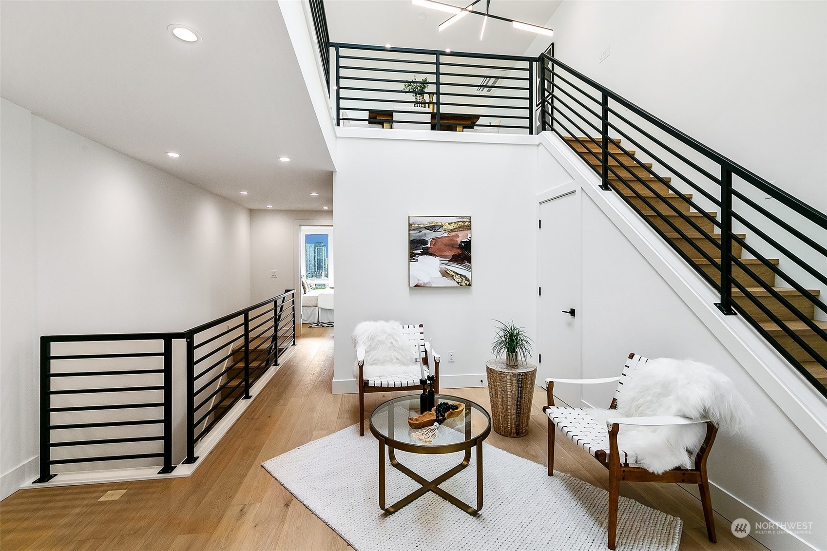 509 Galer Street Seattle, WA 98109 - Photo 4 of 40 a view of a hallway with furniture and wooden floor