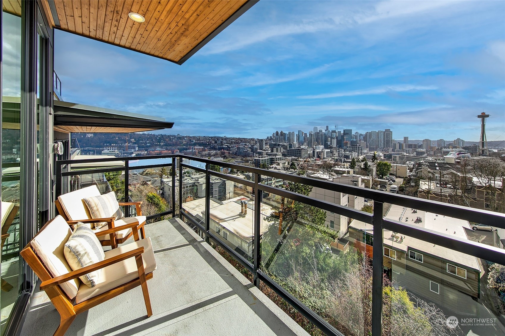 509 Galer Street Seattle, WA 98109 - Photo 9 of 40 a view of a chairs and table in the balcony