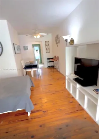 a lobby with furniture and flat screen tv