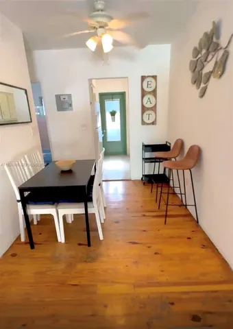 a workspace with furniture and wooden floor