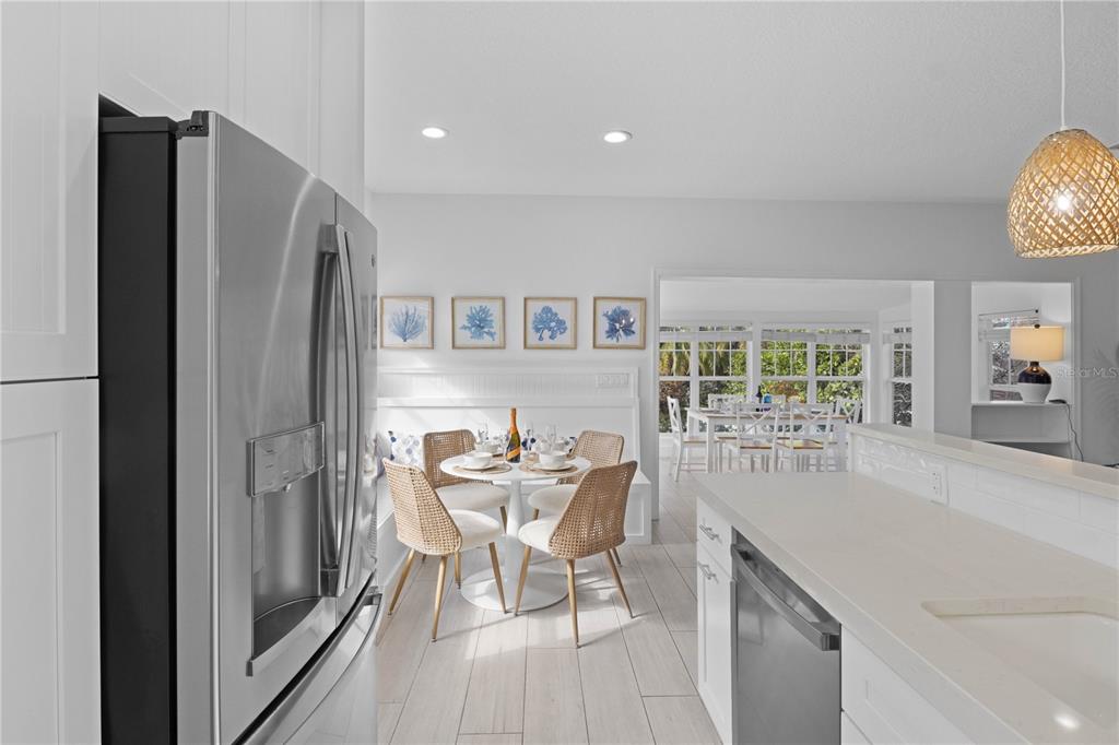 307 Spring Avenue Anna Maria, FL 34216 - Photo 14 of 51 a kitchen with stainless steel appliances granite countertop a refrigerator and a stove top oven