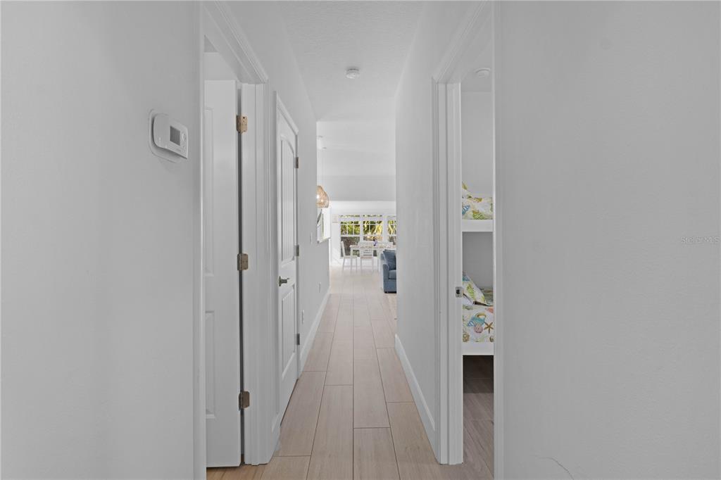 307 Spring Avenue Anna Maria, FL 34216 - Photo 15 of 51 a view of a hallway with wooden floor and closet