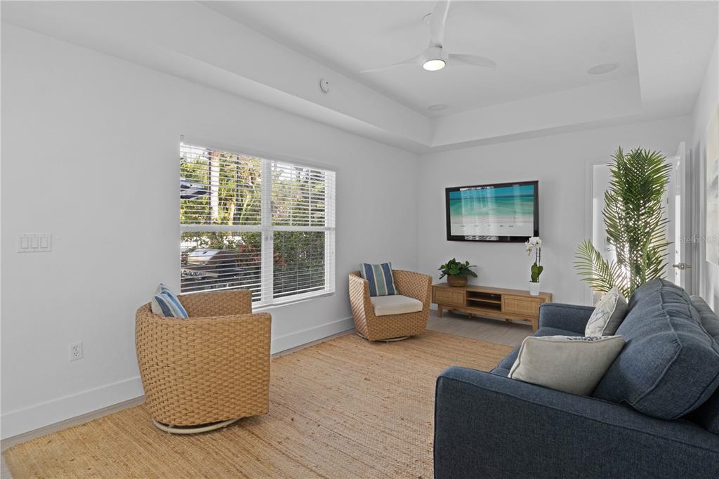 307 Spring Avenue Anna Maria, FL 34216 - Photo 17 of 51 a living room with furniture and a potted plant