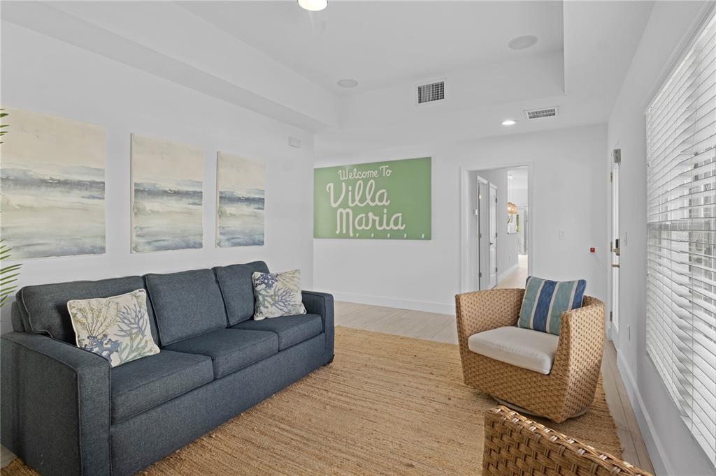 307 Spring Avenue Anna Maria, FL 34216 - Photo 18 of 51 a living room with furniture and a large window