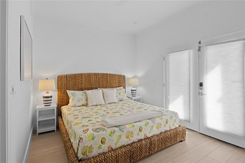 307 Spring Avenue Anna Maria, FL 34216 - Photo 19 of 51 a bedroom with a bed and a walk in closet