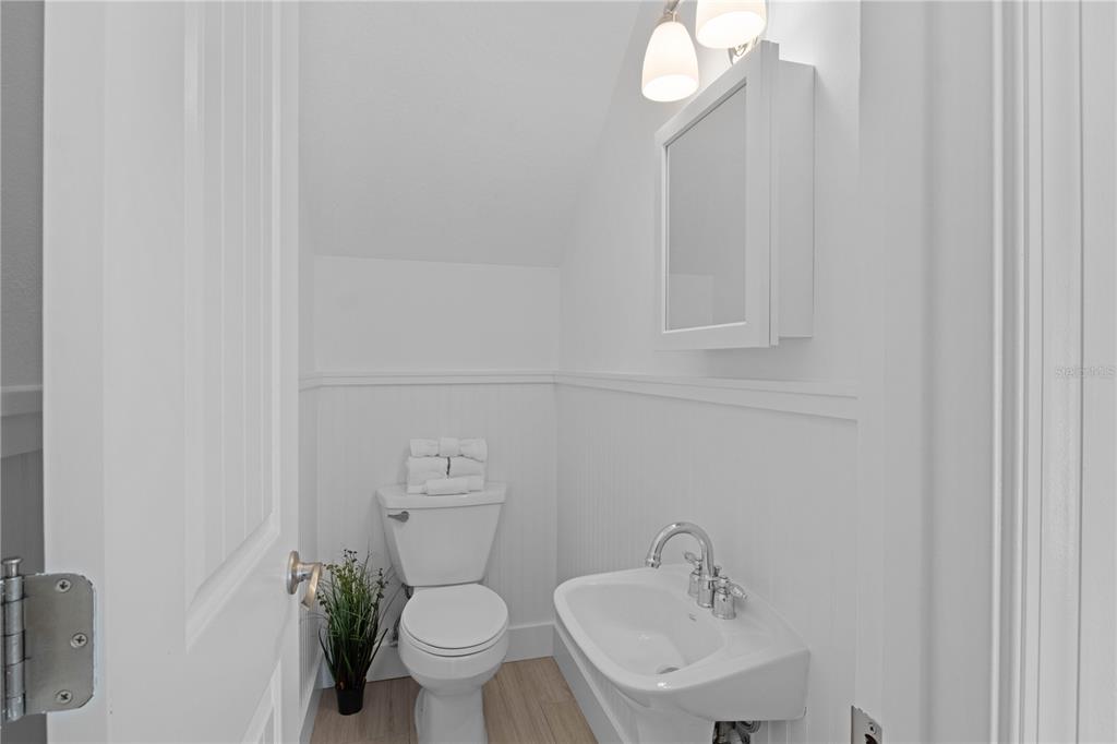 307 Spring Avenue Anna Maria, FL 34216 - Photo 20 of 51 a bathroom with a sink a toilet and a mirror