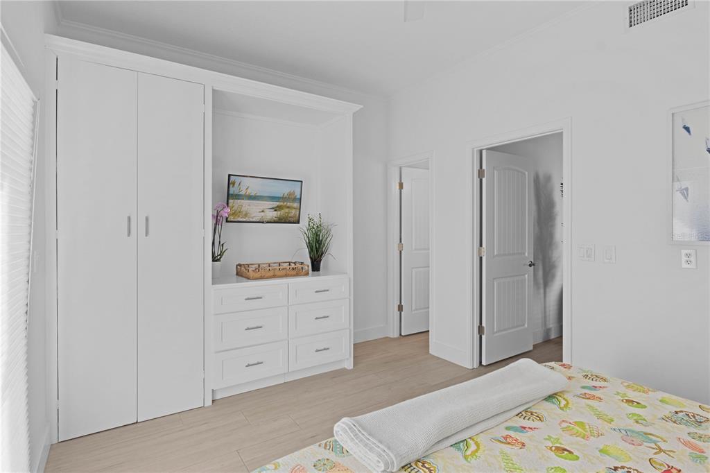 307 Spring Avenue Anna Maria, FL 34216 - Photo 22 of 51 a bedroom with a bed and hallway