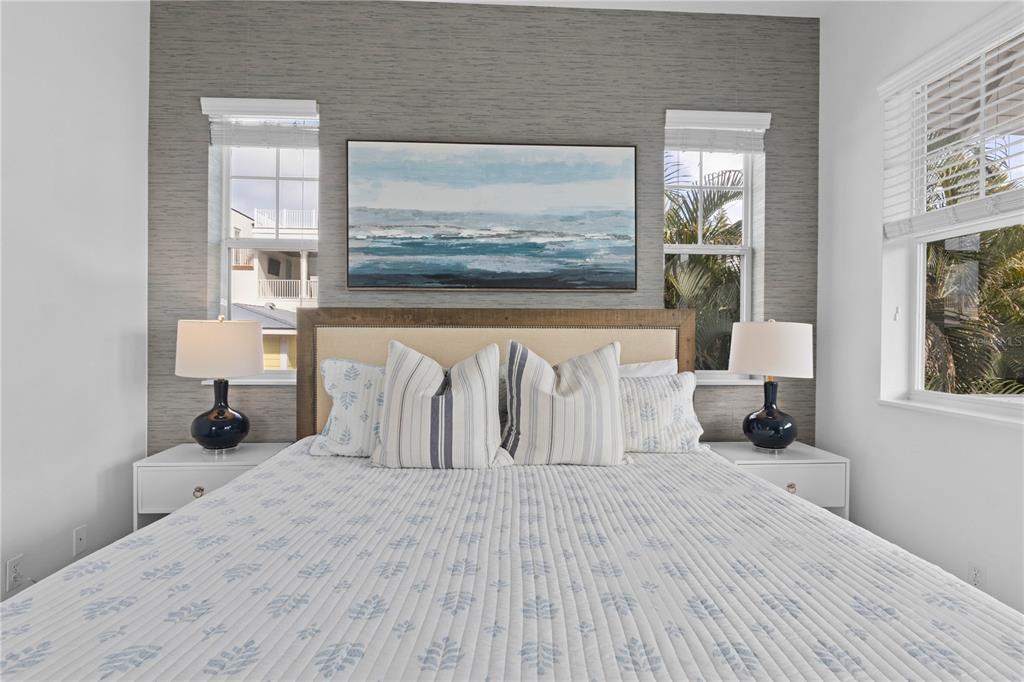 307 Spring Avenue Anna Maria, FL 34216 - Photo 27 of 51 a bedroom with a bed and a large mirror