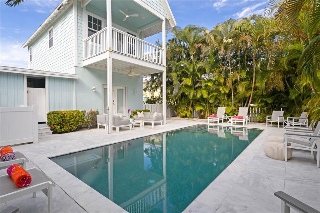 307 Spring Avenue Anna Maria, FL 34216 - Photo 38 of 51 a swimming pool with outdoor seating and yard