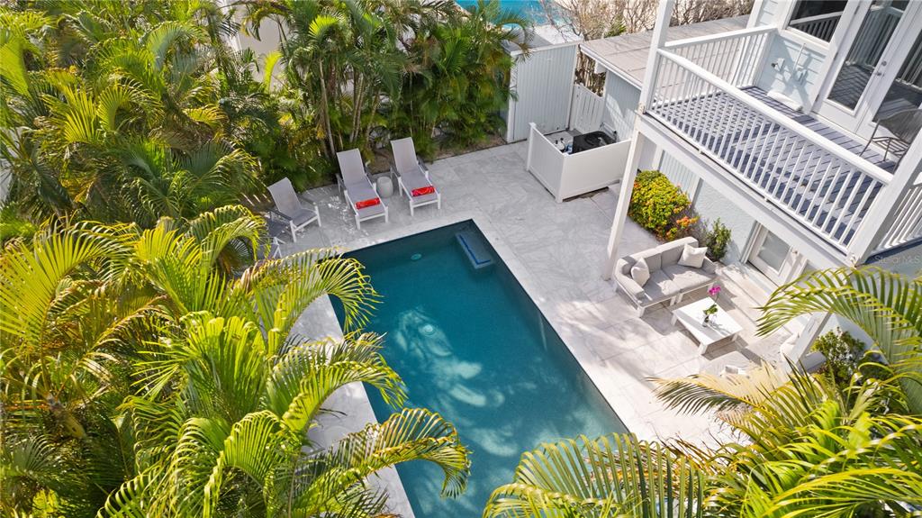 307 Spring Avenue Anna Maria, FL 34216 - Photo 48 of 51 an aerial view of residential house with pool and garden