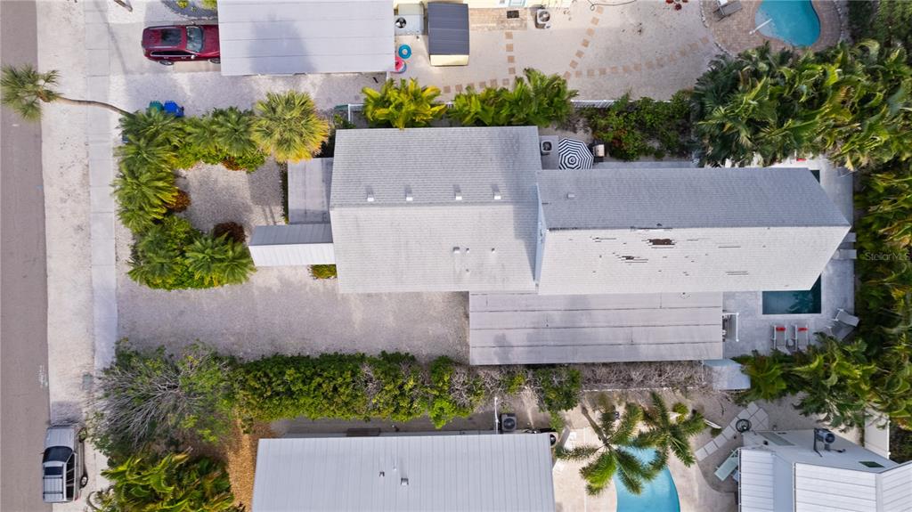 307 Spring Avenue Anna Maria, FL 34216 - Photo 50 of 51 an aerial view of a house with a garden