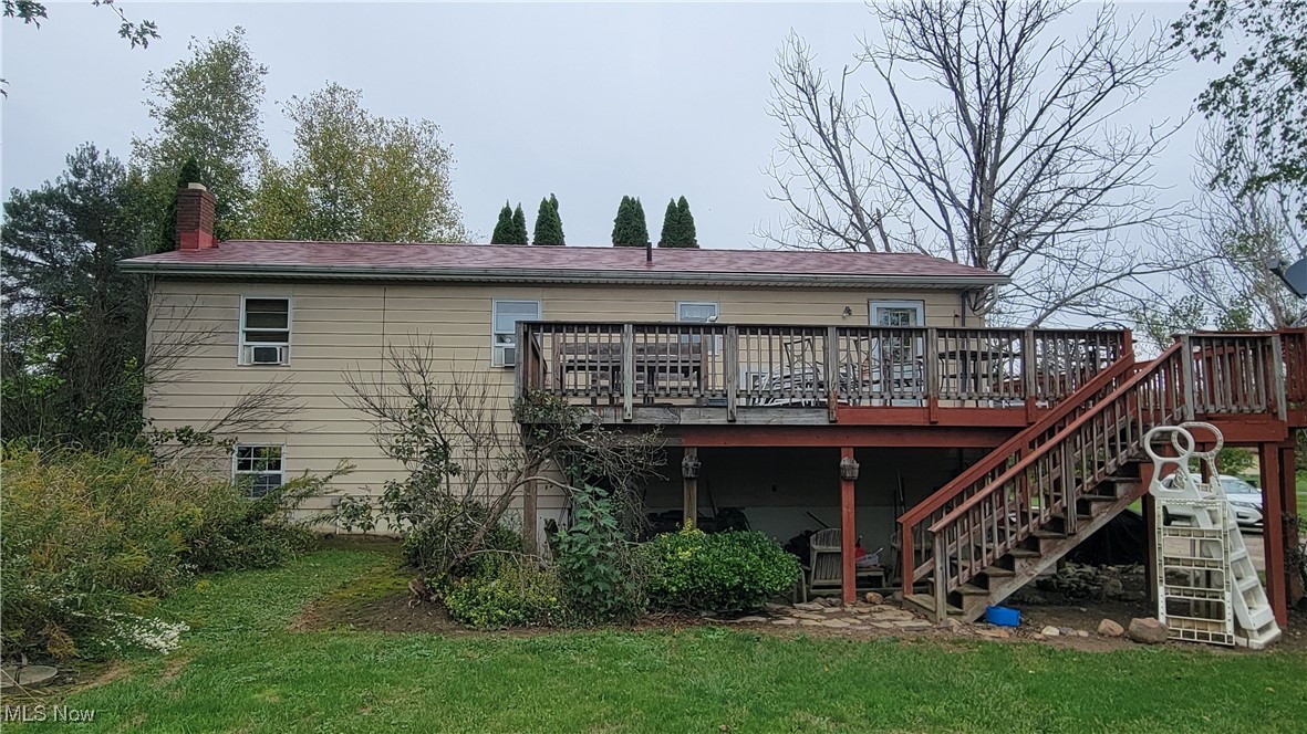 4133 Beat Road Litchfield, OH 44253 - Photo 24 of 25 Back of house with a deck and a yard