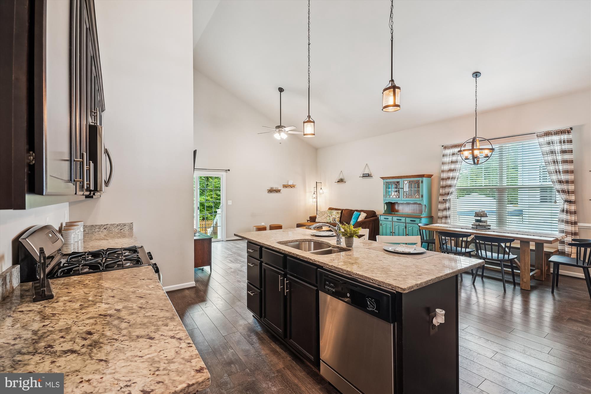 12141 Aster Road Bristow, VA 20136 - Photo 13 of 65 a kitchen with stainless steel appliances granite countertop a stove and a sink