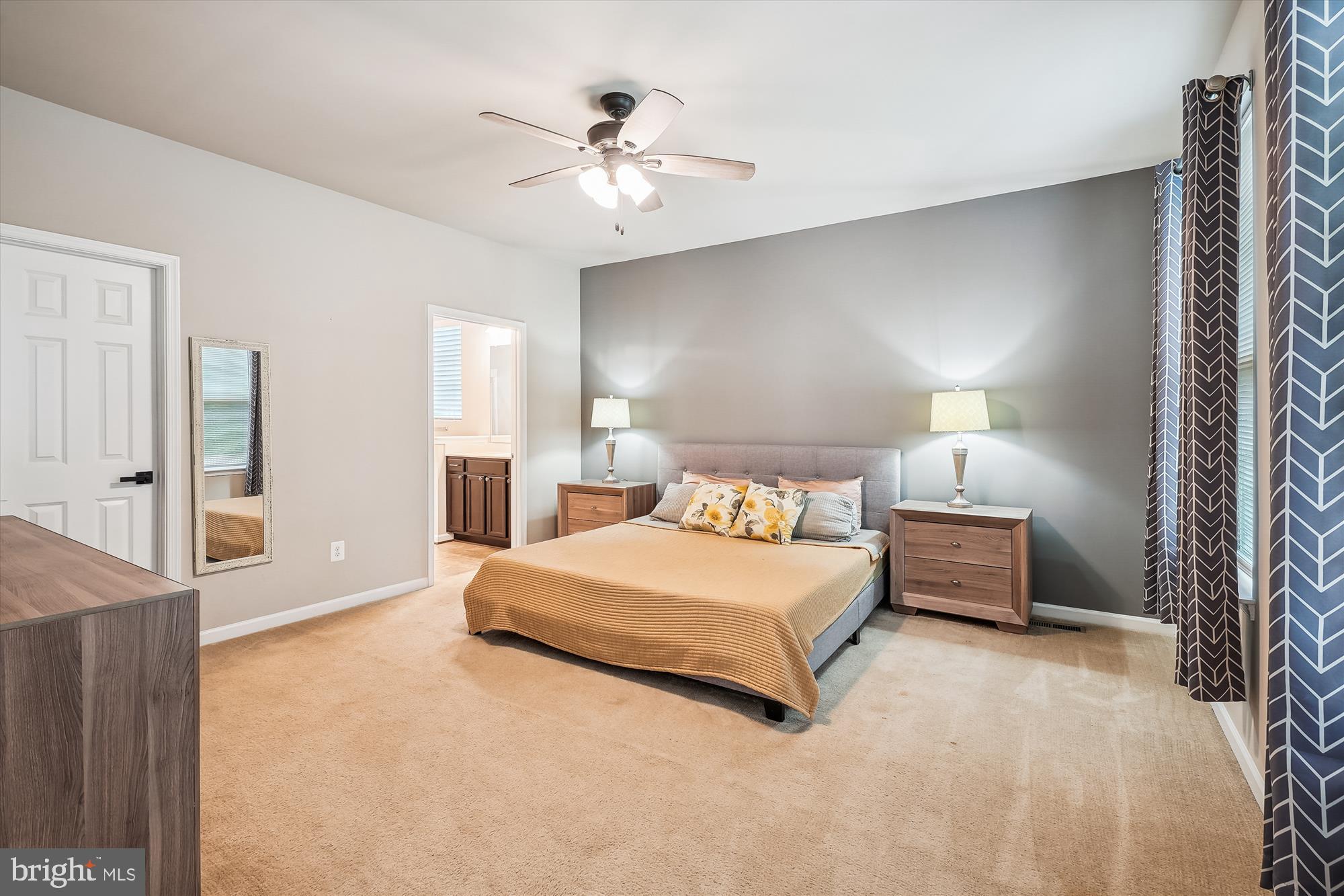 12141 Aster Road Bristow, VA 20136 - Photo 19 of 65 a bedroom with a bed and a chandelier