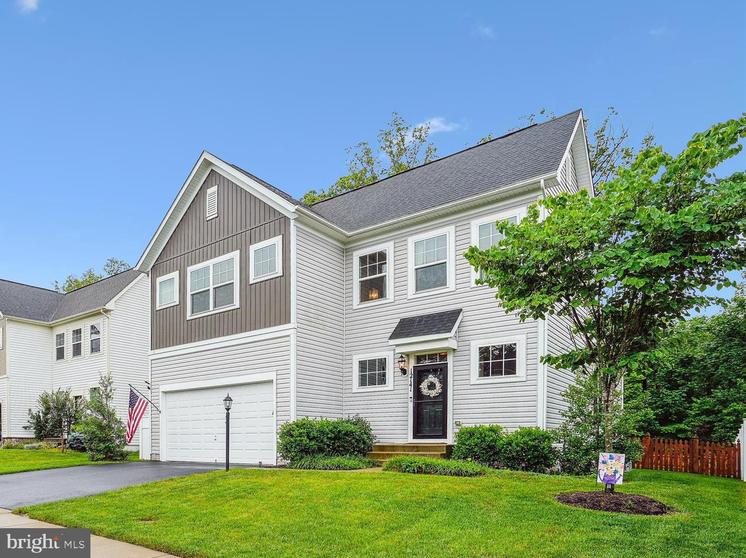 12141 Aster Road Bristow, VA 20136 - Photo 2 of 65 a front view of a house with a garden and plants