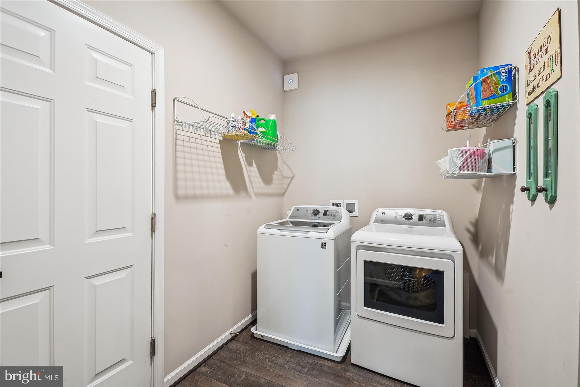 12141 Aster Road Bristow, VA 20136 - Photo 25 of 65 a view of storage and utility room with washer and dryer