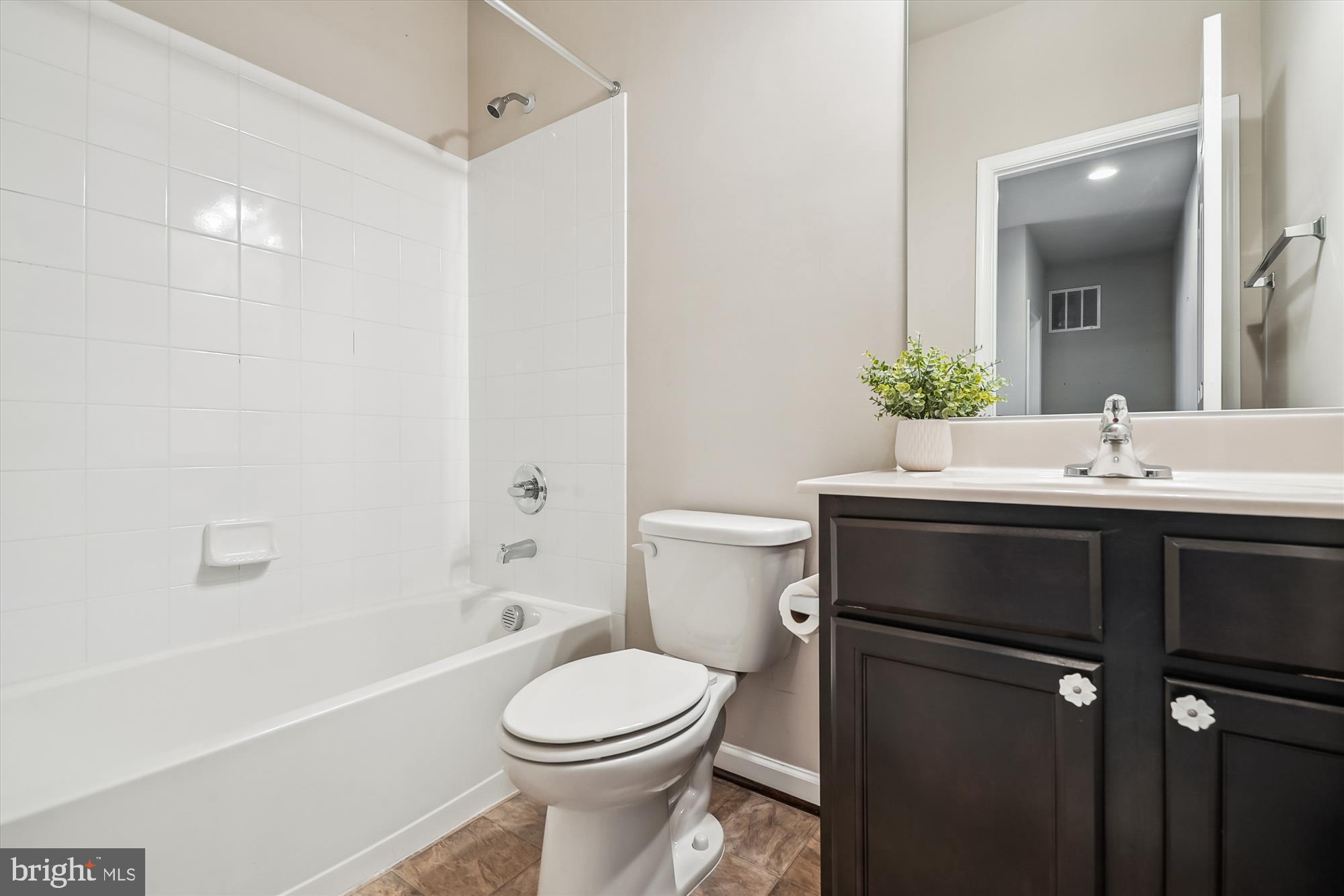 12141 Aster Road Bristow, VA 20136 - Photo 35 of 65 a bathroom with a sink toilet and shower